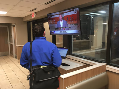 Paul Blume watches his FOX 9 story on TV after filing on deadline